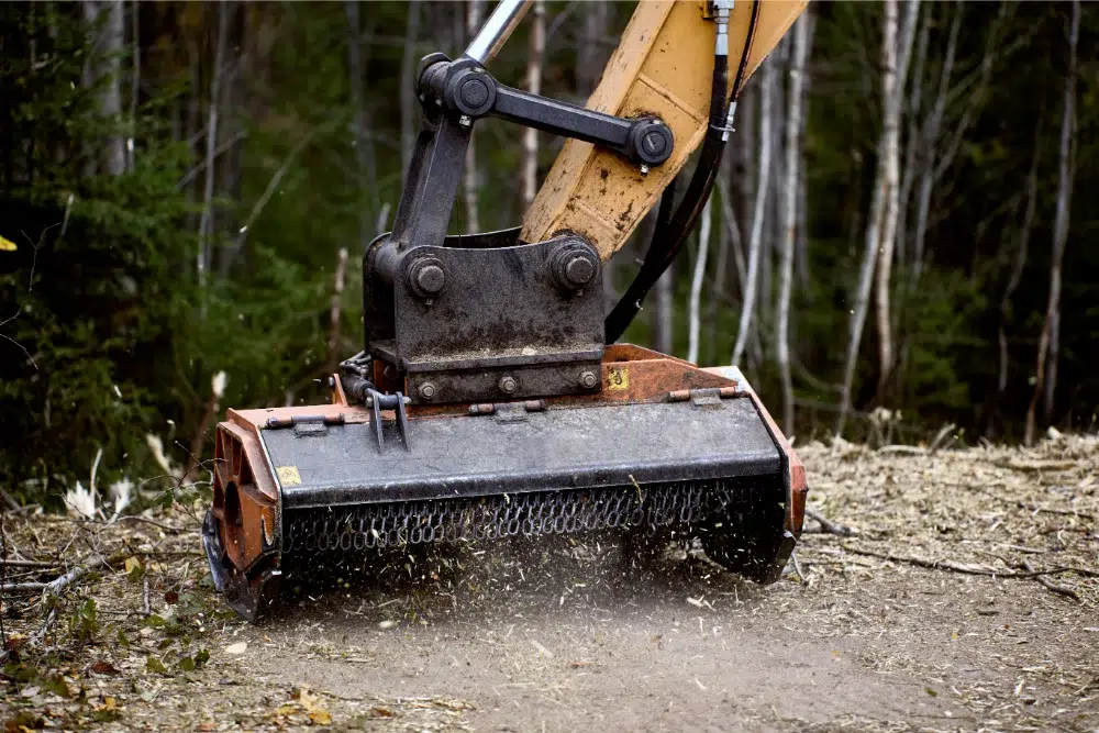 Land Clearing Equipment: What The Pros Use & Why 4 excavator mulching head forestry mulcher clears vegetation on road side land clearing equipment