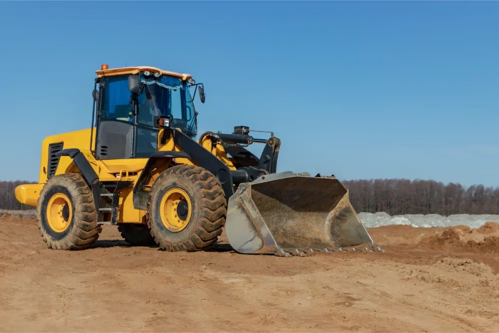 Land Clearing Methods: 5 Common Techniques Explained 5 bulldozer loader moves earth construction site against blue sky earthmoving machine is leveling site construction heavy equipment earthworks land clearing methods,land clearing method,land clearing techniques,methods of land clearing,land clearing costs (SUB PILLAR ) LINKED,what the process involves (land clearign pillar) LINKED,Forestry mulching sub pillar